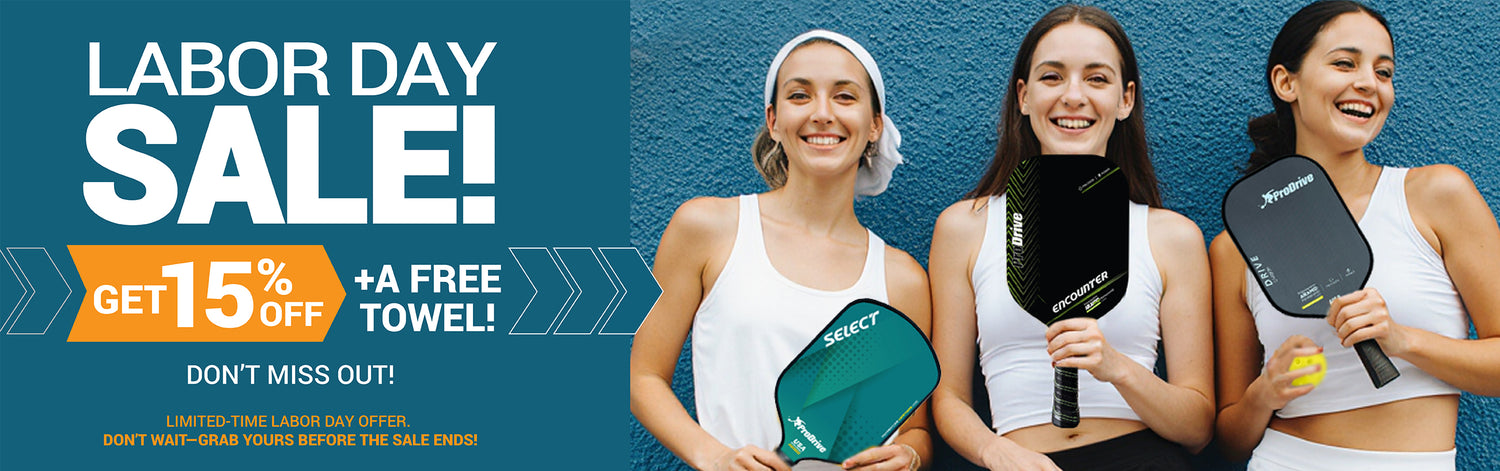 Labor Day Sale promotional banner featuring three women holding pickleball paddles against a blue wall, with large text offering a 15% off and a free towel.
